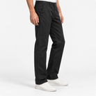 Washed cotton straight trousers with welt pockets in black, three-quarter model view