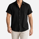 Short-sleeved cotton summer golf t-shirt in black, front model view