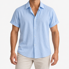 Short-sleeved cotton summer golf t-shirt in blue, front model view
