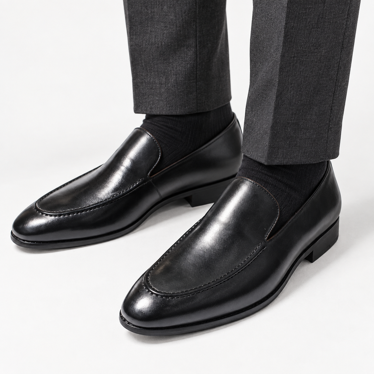 Leonardo pointed toe leather loafers in black, front worn view