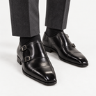 Leonardo double buckle leather shoes in black, front worn view