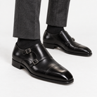 Leonardo double buckle leather shoes in black, side worn view