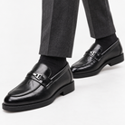 Leonardo slip-on business loafers in black, side worn view