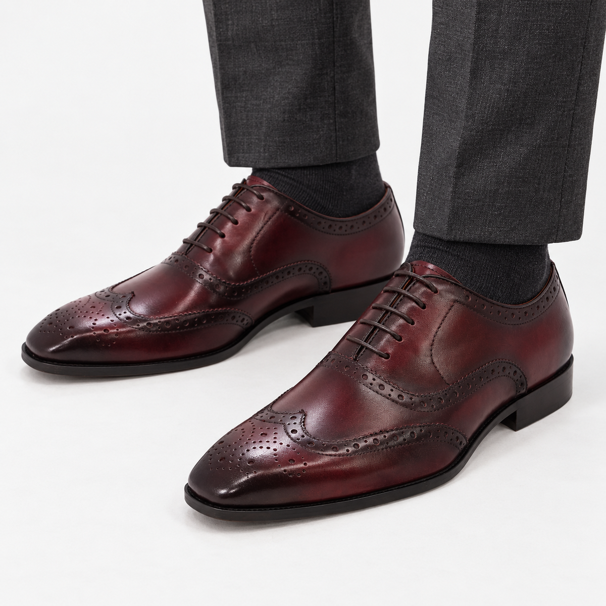 Leonardo genuine leather brogue shoes in wine red, front worn view
