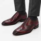 Leonardo genuine leather brogue shoes in wine red, front worn view