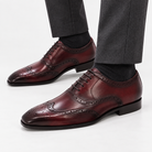 Leonardo genuine leather brogue shoes in wine red, side worn view