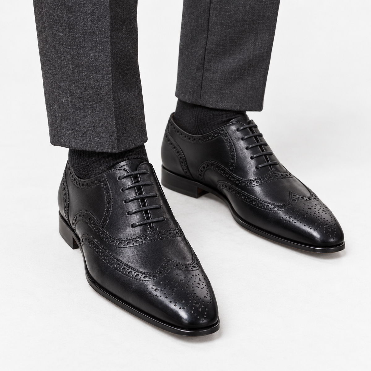 Leonardo genuine leather brogue shoes in black, front worn view