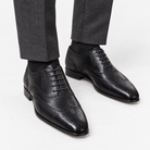 Leonardo genuine leather brogue shoes in black, front worn view