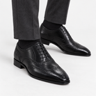 Leonardo genuine leather brogue shoes in black, side worn view