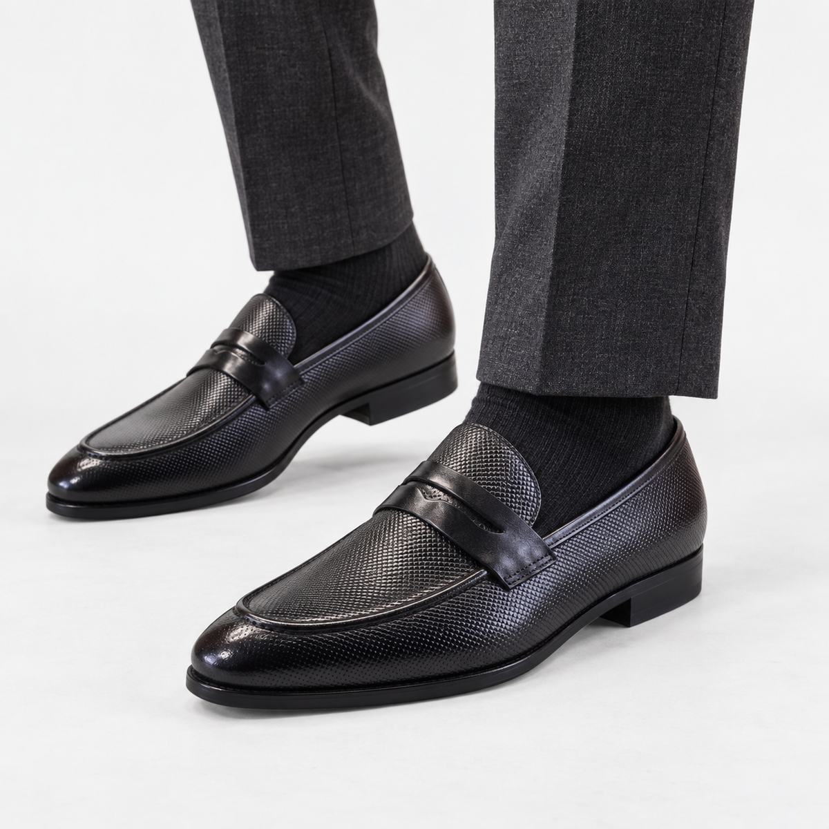 Leonardo genuine leather penny loafers in black, side worn view