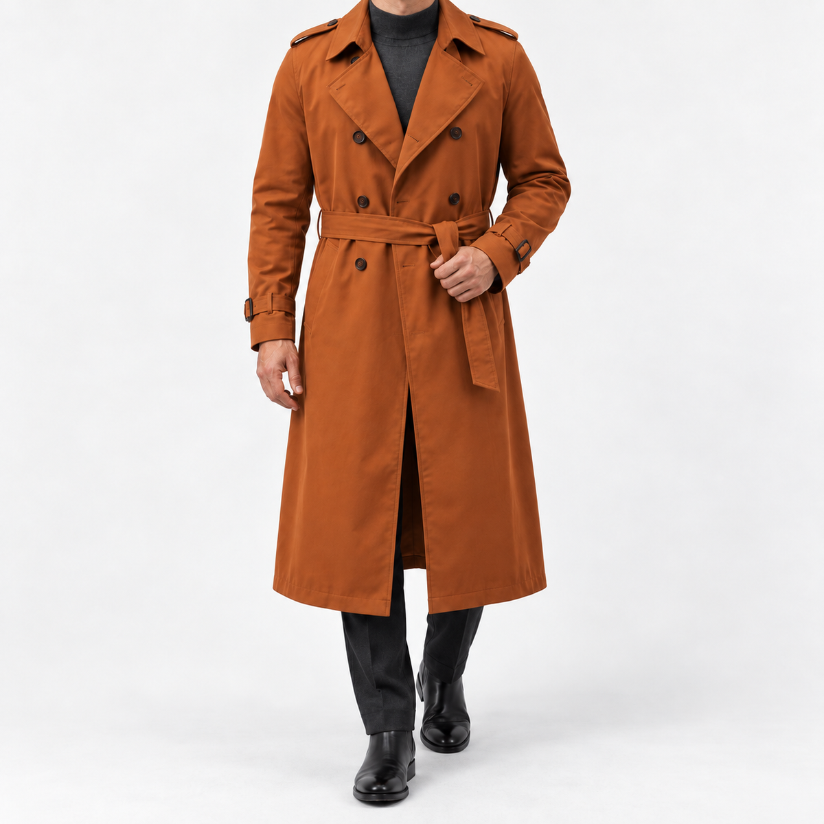 Long double breasted trench coat with a belt in burnt orange — front view on a male model