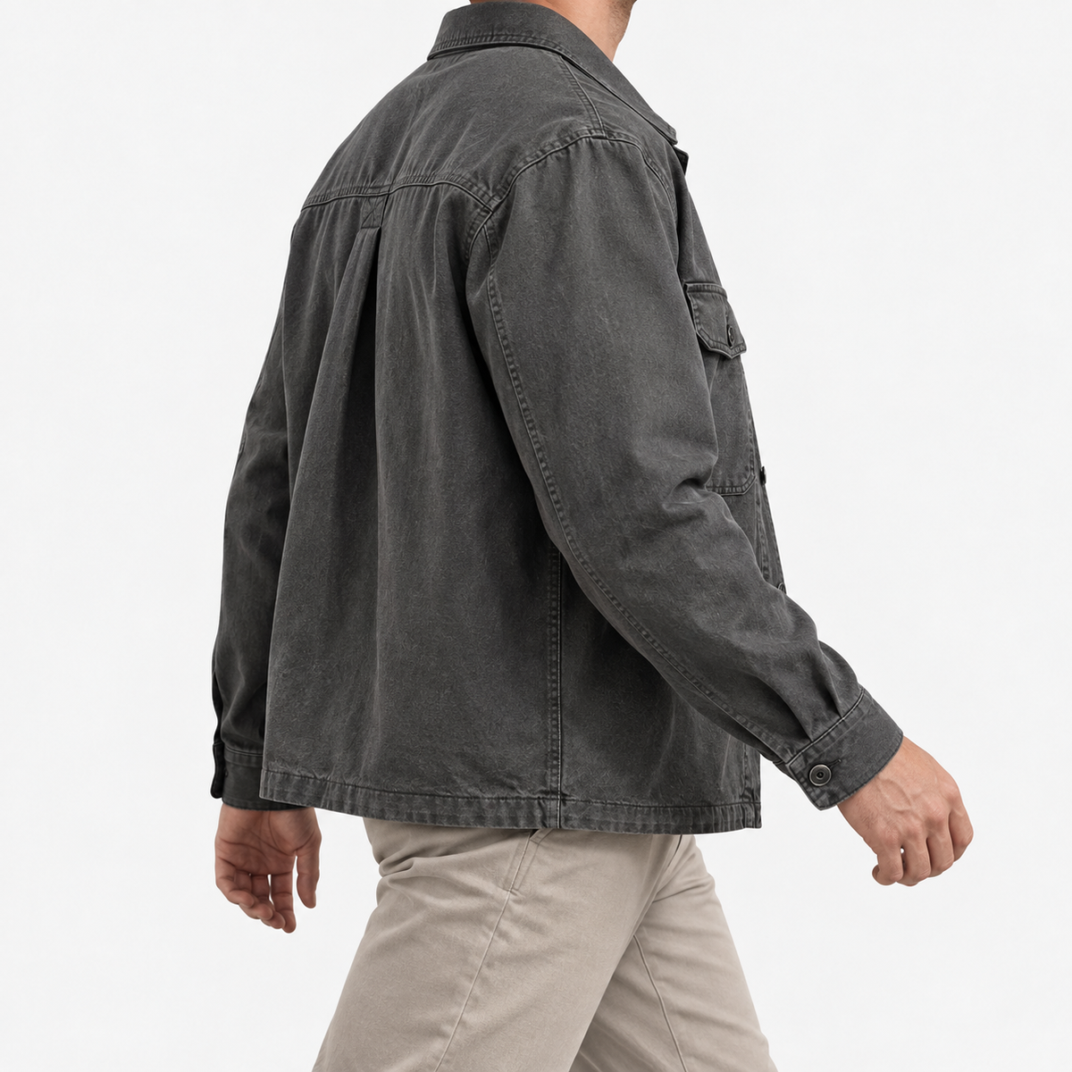 Washed cotton utility jacket with a zip front in charcoal — side view on a male model