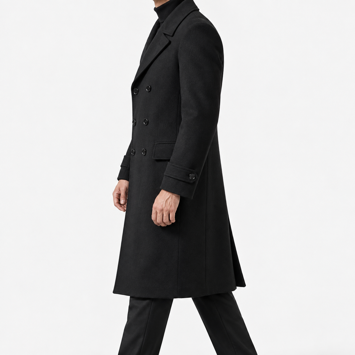 Long double breasted wool blend coat with cuff tabs in black — male model side view