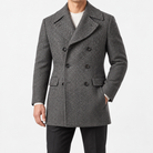 Herringbone double breasted coat with wide lapels in gray — male model front view