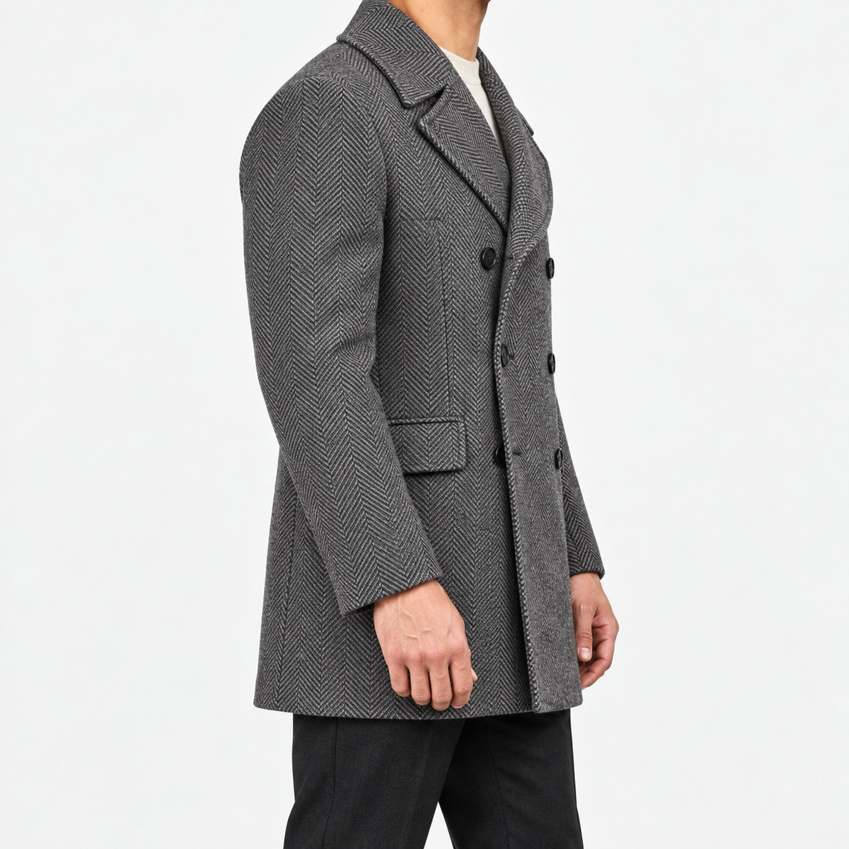 Herringbone double breasted coat with wide lapels in gray — male model side view