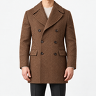 Herringbone double breasted coat with wide lapels in brown — male model front view