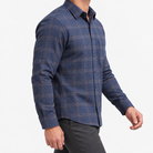 Brushed cotton flannel shirt with a chest pocket in navy windowpane on a male model side view