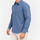 Brushed cotton flannel shirt with a chest pocket in blue on a male model side view