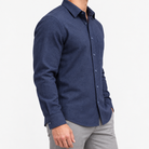 Brushed cotton flannel shirt with a chest pocket in navy on a male model side view