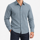 Brushed cotton flannel shirt with a chest pocket in blue gray microcheck on a male model front view