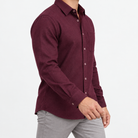 Brushed cotton flannel shirt with a chest pocket in burgundy on a male model side view