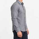 Brushed cotton flannel shirt with a chest pocket in gray microcheck on a male model side view
