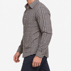 Brushed cotton flannel shirt with a chest pocket in cream gingham on a male model side view