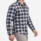 Pure cotton oxford shirt with a chest pocket in navy and green plaid on a male model side view