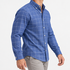 Pure cotton oxford shirt with a chest pocket in blue windowpane on a male model side view