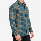 Pure cotton oxford shirt with a chest pocket in dark green check on a male model side view