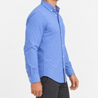 Pure cotton oxford shirt with a chest pocket in blue microprint on a male model side view