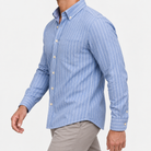 Pure cotton oxford shirt with a chest pocket in light blue pinstripe on a male model side view