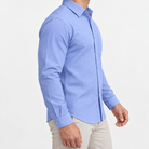Slim cotton blend shirt with a chest pocket in cornflower blue textured check on a male model side view