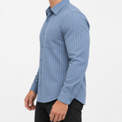 Slim cotton blend shirt with a chest pocket in steel blue stripe on a male model side view