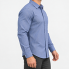 Slim cotton blend shirt with a chest pocket in indigo stripe on a male model side view