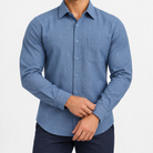 Slim cotton blend shirt with a chest pocket in deep blue textured check on a male model front view