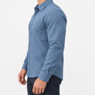 Slim cotton blend shirt with a chest pocket in deep blue textured check on a male model side view