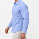 Slim cotton blend shirt with a chest pocket in light blue patterned on a male model side view