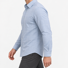 Slim cotton blend shirt with a chest pocket in light blue windowpane on a male model side view