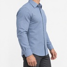 Slim cotton blend shirt with a chest pocket in slate blue textured check on a male model side view