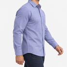 Slim cotton blend shirt with a chest pocket in lavender blue windowpane on a male model side view