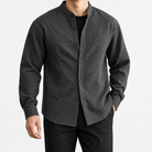 Relaxed checked shirt with curved front seams in dark gray — front view on a male model