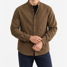 Relaxed checked shirt with curved front seams in brown — front view on a male model