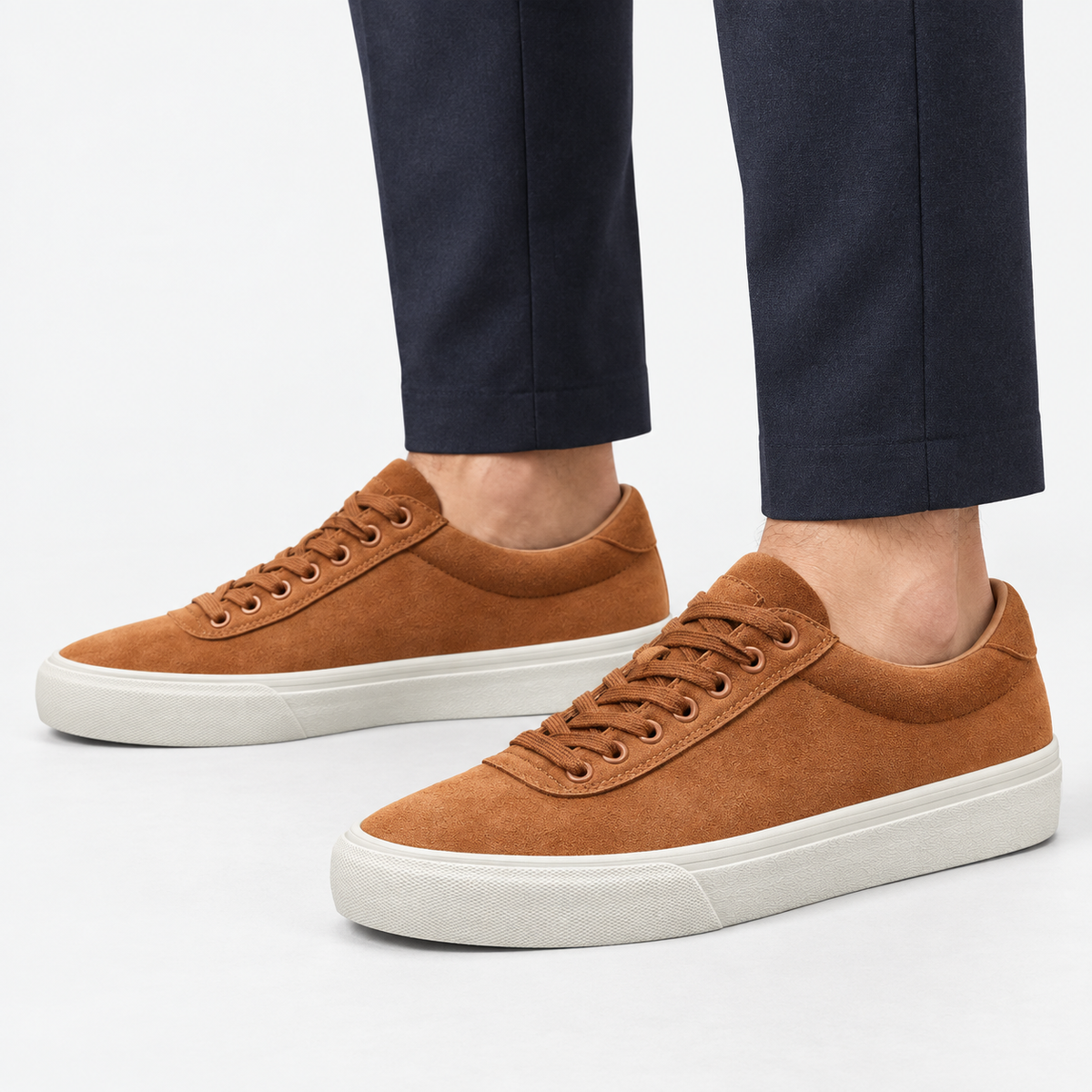 Canvas lace up sneakers with contrast soles in brown, side view on a model
