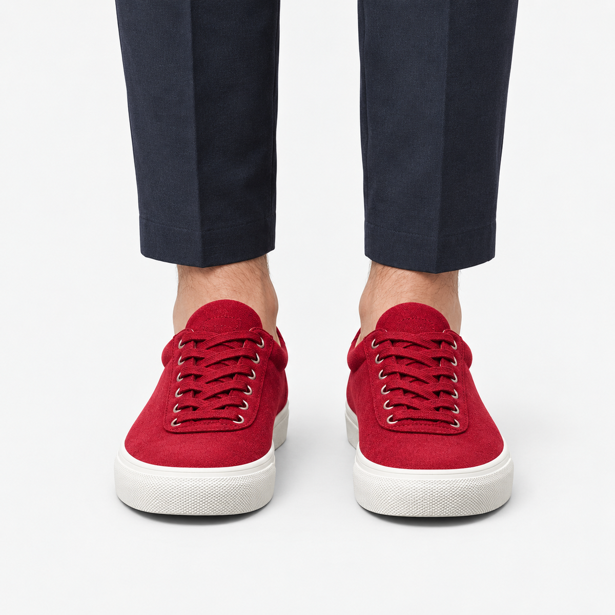 Canvas lace up sneakers with contrast soles in red, front view on a model