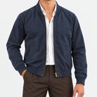 Cotton bomber jacket with ribbed trim in navy, front view on a model