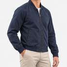 Cotton bomber jacket with ribbed trim in navy, side view on a model