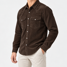 Cotton corduroy western shirt in dark brown, side view on a model