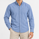 Cotton oxford button down shirt in denim blue, front view on a model