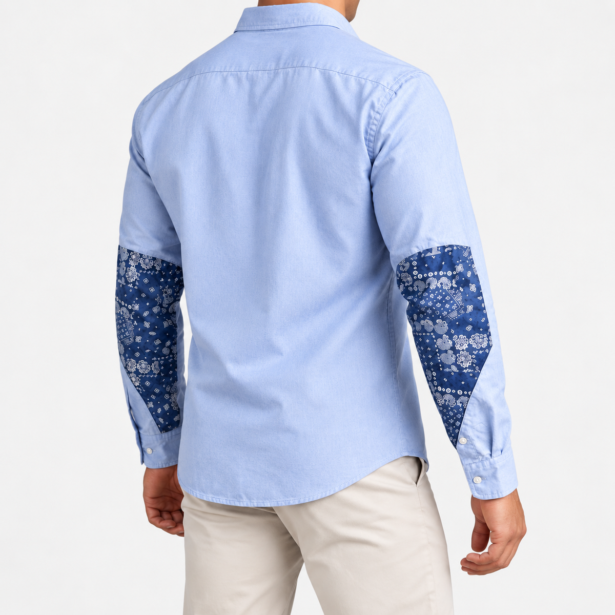 Cotton oxford shirt with paisley sleeve panels in sky blue, side view on a model